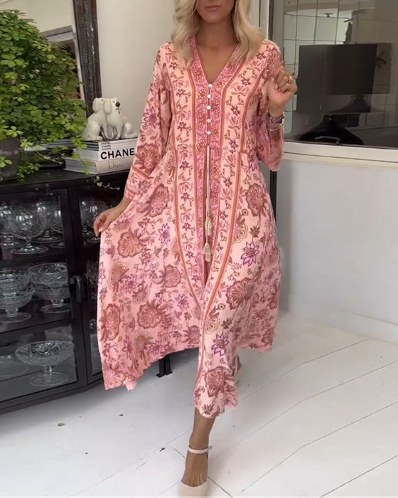 Elegante jurk met V-hals, knoopsluiting en trekkoord met print