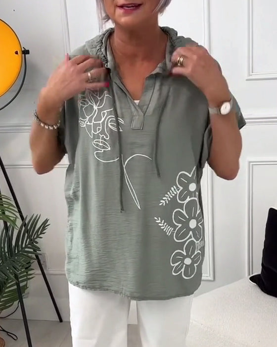 Casual blouse met korte mouwen en bloemenprint met capuchon