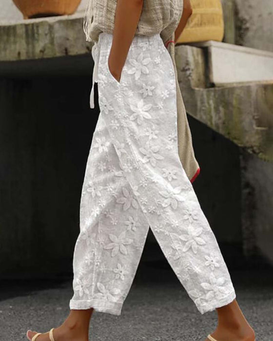 Effen casual broek met geborduurde bloemen en veters