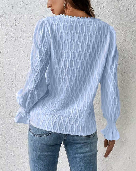 Elegante blouse met jacquard en ruchesmouw