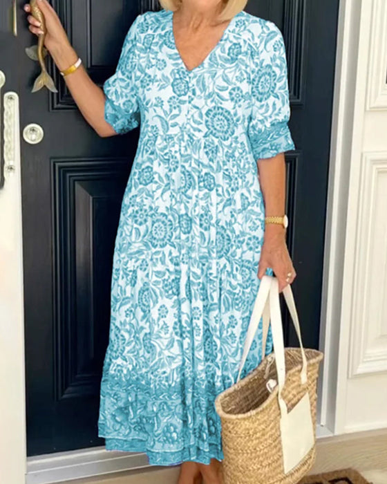 Blauwe jurk met V-hals en bloemenprint