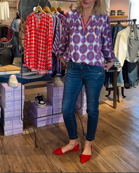 Elegante blouse met V-hals en geometrische print