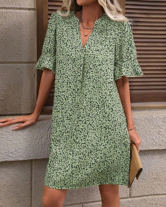 Elegante jurk met V-hals en print