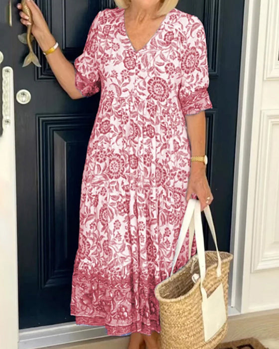 Blauwe jurk met V-hals en bloemenprint