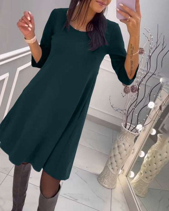 Effen jurk met strik op de rug