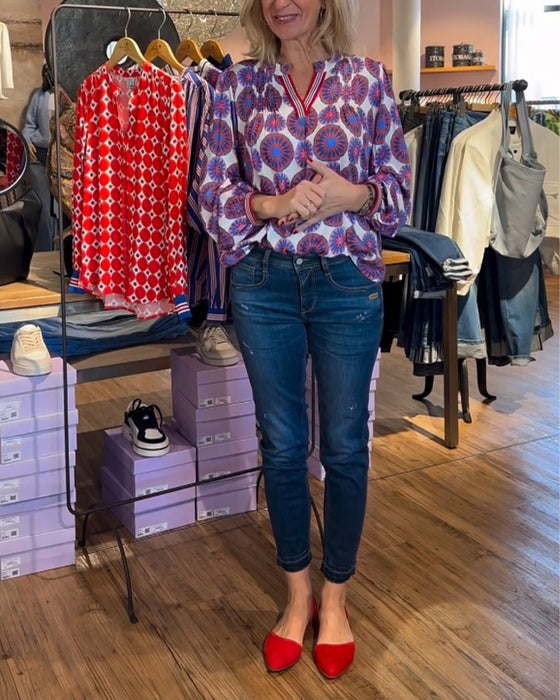 Elegante blouse met V-hals en geometrische print