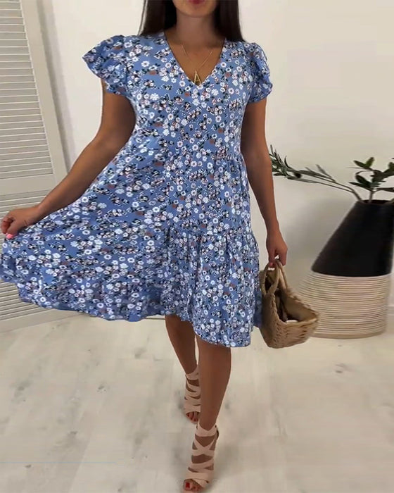 Mouwloze midi-jurk met V-hals en bloemenprint