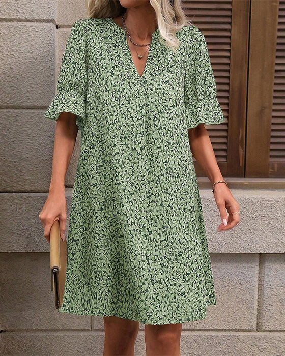 Elegante jurk met V-hals en print