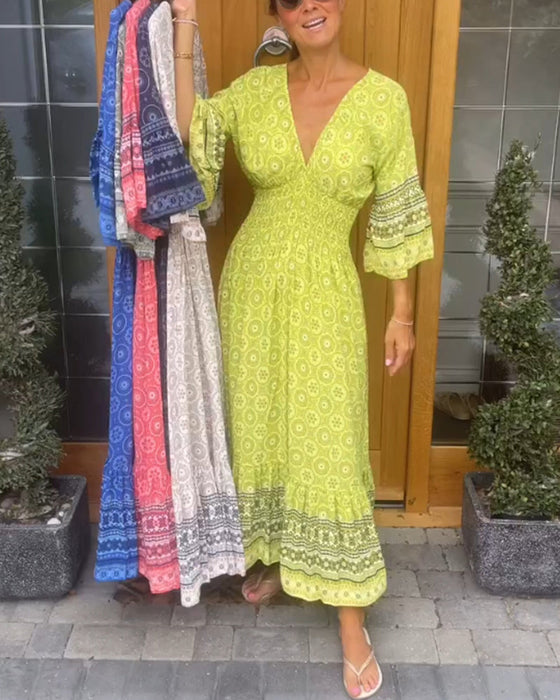 Lange jurk met een diepe V-hals en lange mouwen