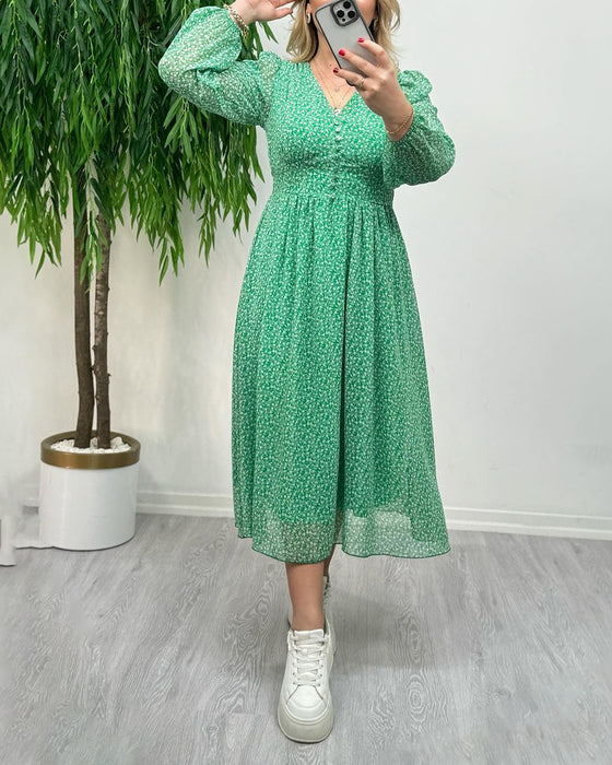 Elegante jurk met knopen en print