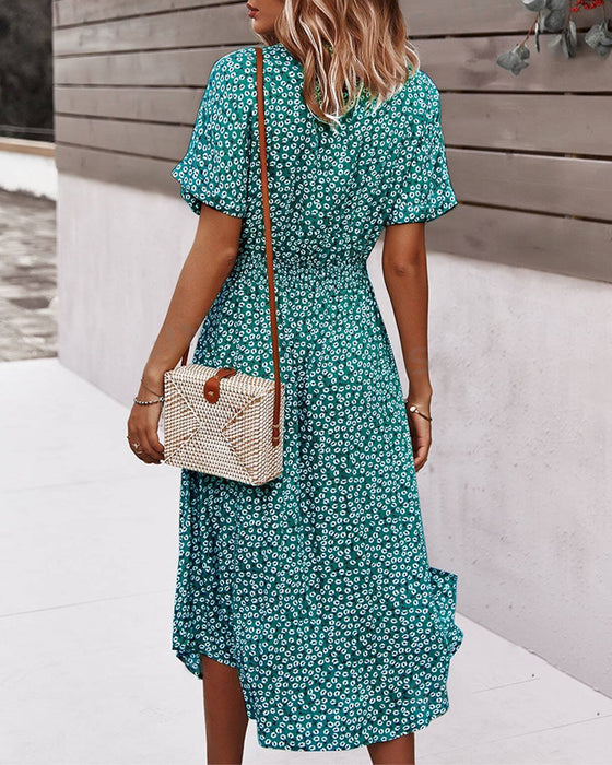 Jurk met korte mouwen, ingesnoerde taille en bloemenprints