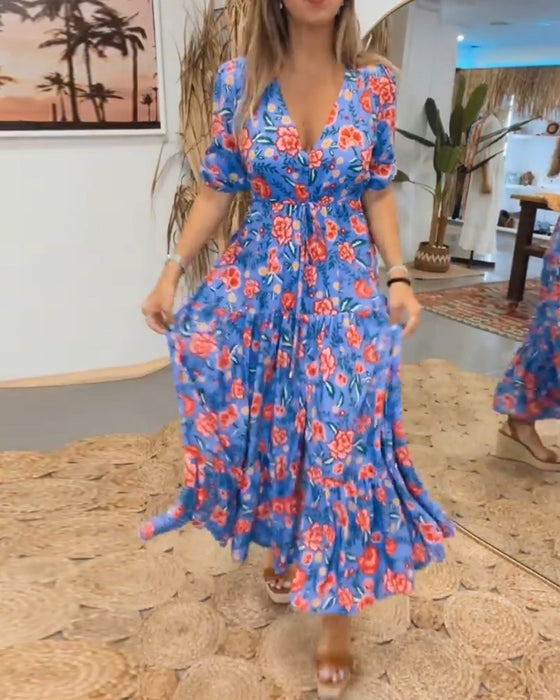 Jurk met rozenprint en splitten