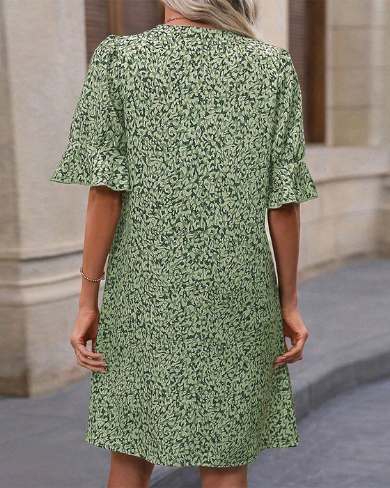 Elegante jurk met V-hals en print