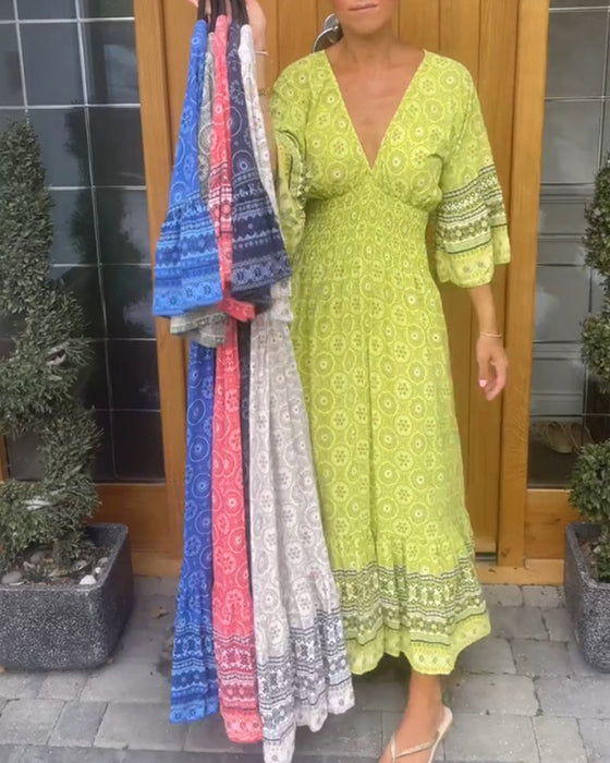 Lange jurk met een diepe V-hals en lange mouwen