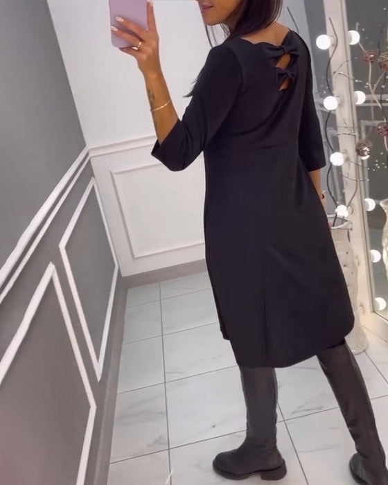 Effen jurk met strik op de rug