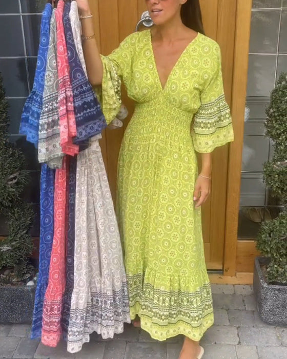 Lange jurk met een diepe V-hals en lange mouwen