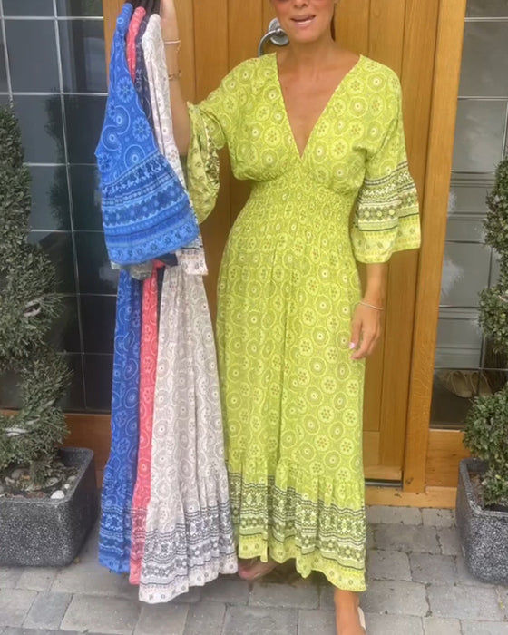 Lange jurk met een diepe V-hals en lange mouwen