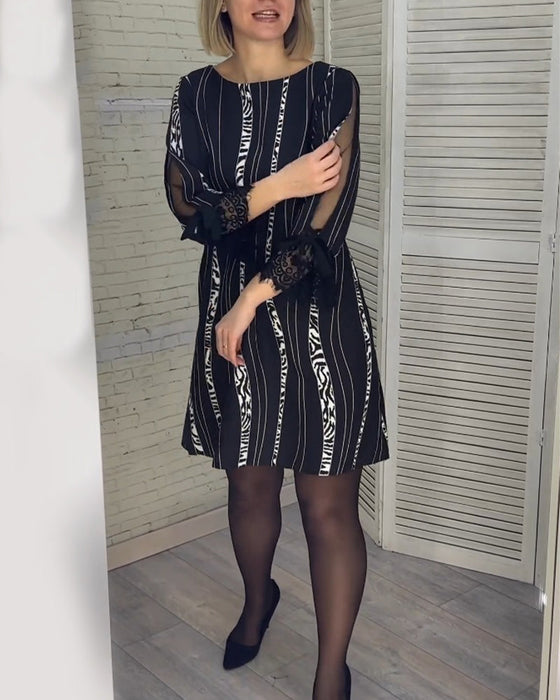 Gestreepte jurk tot op de knie