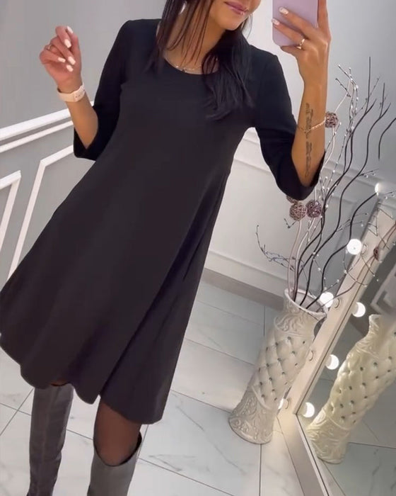 Effen jurk met strik op de rug