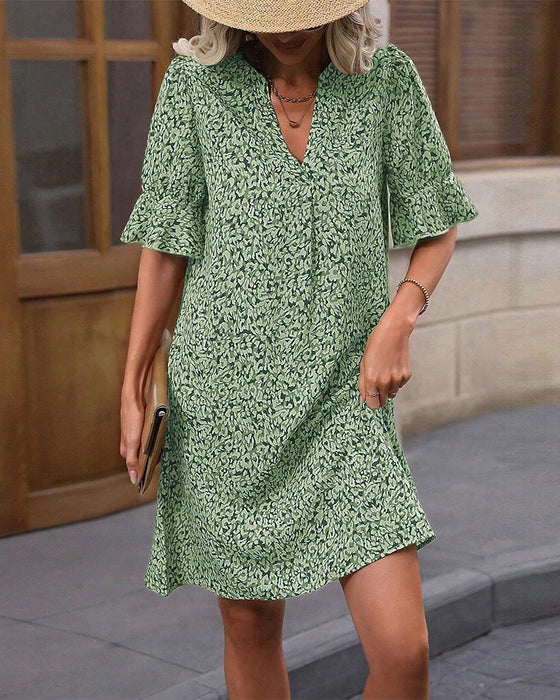 Elegante jurk met V-hals en print