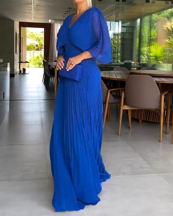 Jurk met plooien en ingesnoerde taille